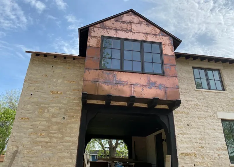 Copper metal panel facade on a stone building for Roof Repair in Pleasanton